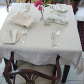 Breakfast table with white linen